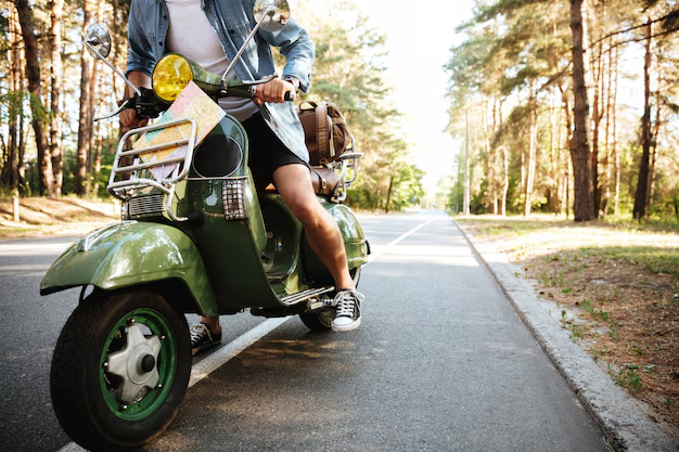 Guy riding a scooter